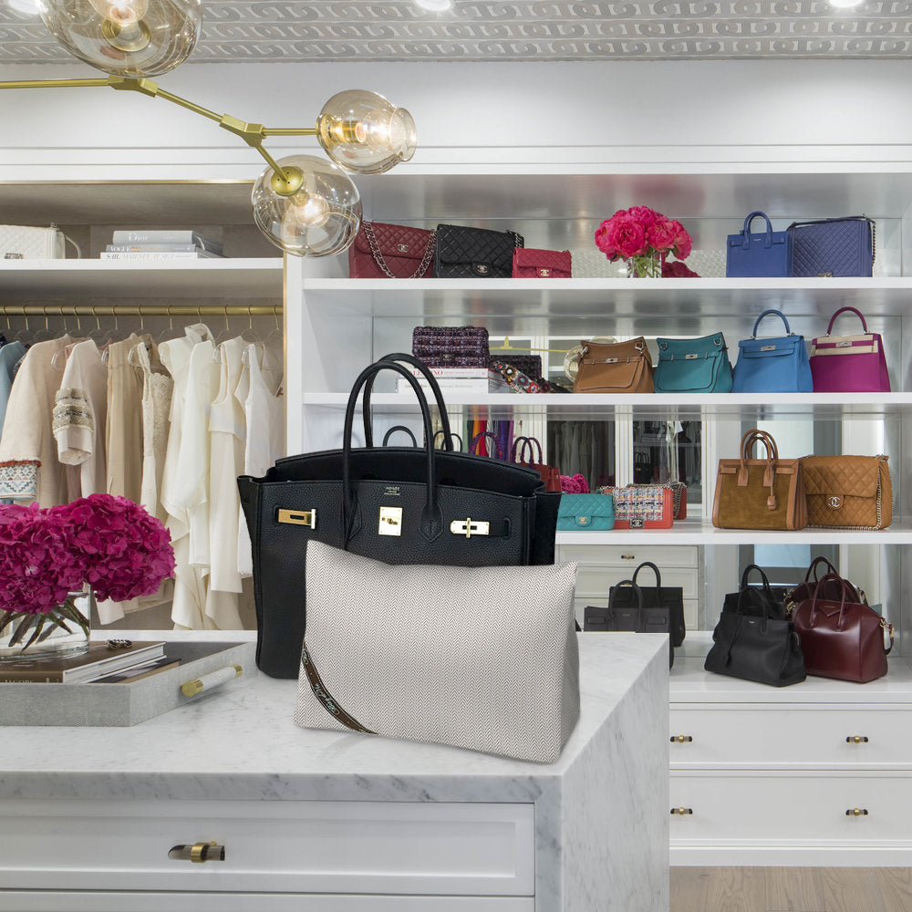 Bag-a-Vie herringbone purse shaper pillow for Hermes Birkin 25 sitting on a marble counter in a luxury closet