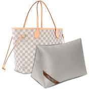 Bag-a-Vie grey herringbone purse shaper pillow insert next to a white and grey checkered tote bag for storage