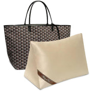 Bag-a-Vie beige purse shaper pillow insert inside a patterned designer tote bag for shape retention and storage.