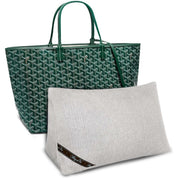 Bag-a-Vie purse shaper pillow in light grey herringbone fabric placed in front of a green patterned tote bag