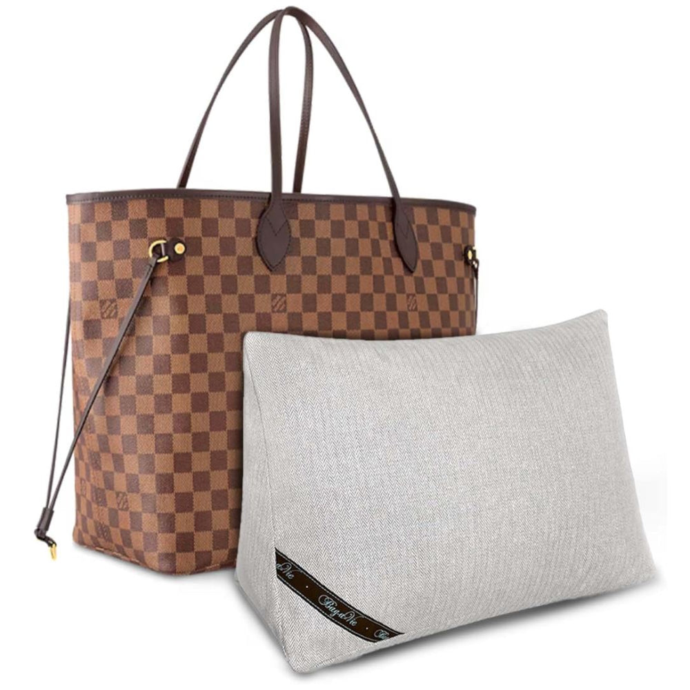 Bag-a-Vie purse shaper pillow in light grey fabric next to a brown checkered tote bag for handbag storage